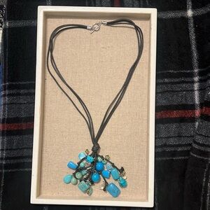 Beautiful leather rope with turquoise stones.